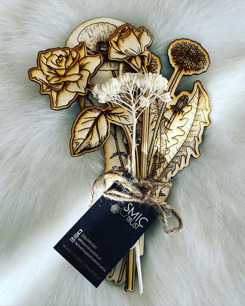 A bouquet of four laser cut fir and one white dried flowers that will last forever